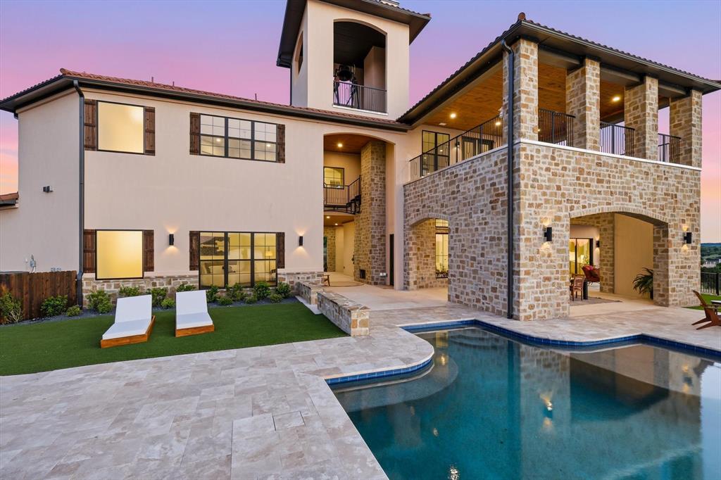 Formal dining room overlooking the infinity pool and lake